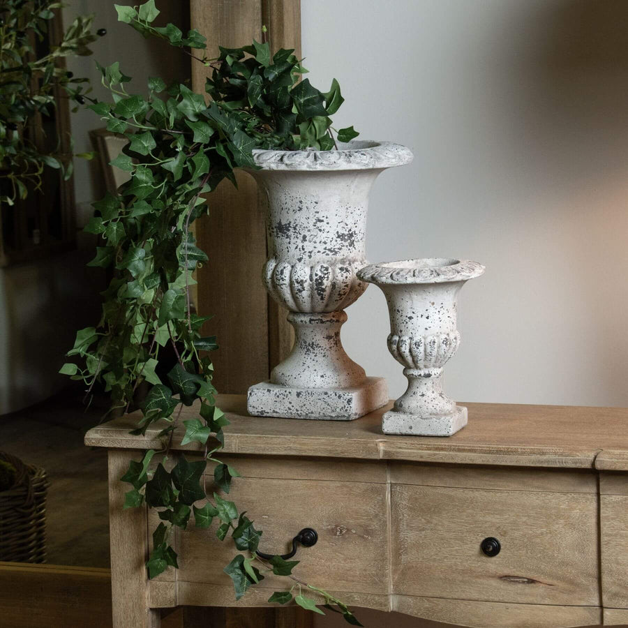 Handcrafted stone-effect ceramic urn with fluted design, neutral color, and classical-modern style for home decor. by Sostter at brixbailey.com