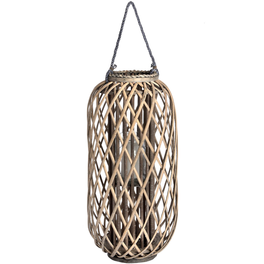 Handwoven rattan lantern with intricate natural weave, rich brown, creates warm light patterns for indoor or outdoor decor. by Sostter at brixbailey.com