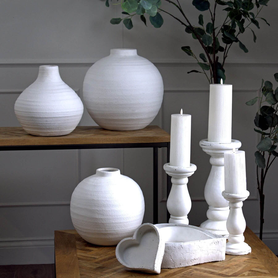 Matt white ceramic candle holder with clean lines, minimalist design, and smooth finish for modern interiors. by Sostter at brixbailey.com