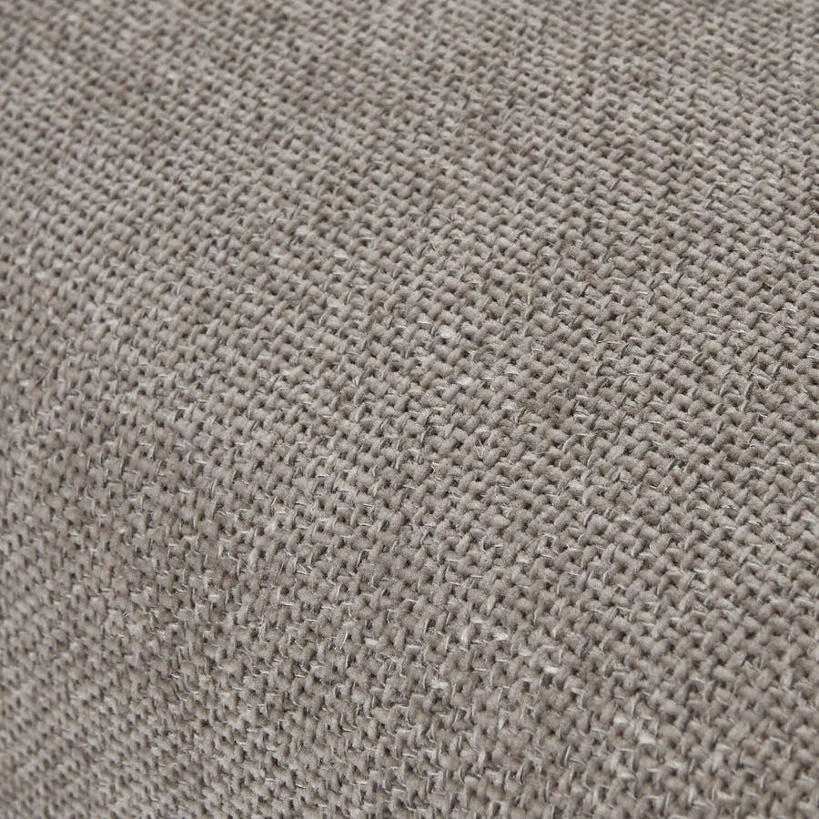 Taupe woven dining chair with dark wood frame, handwoven fabric, and ergonomic curved silhouette for modern interiors by Sostter at brixbailey.com