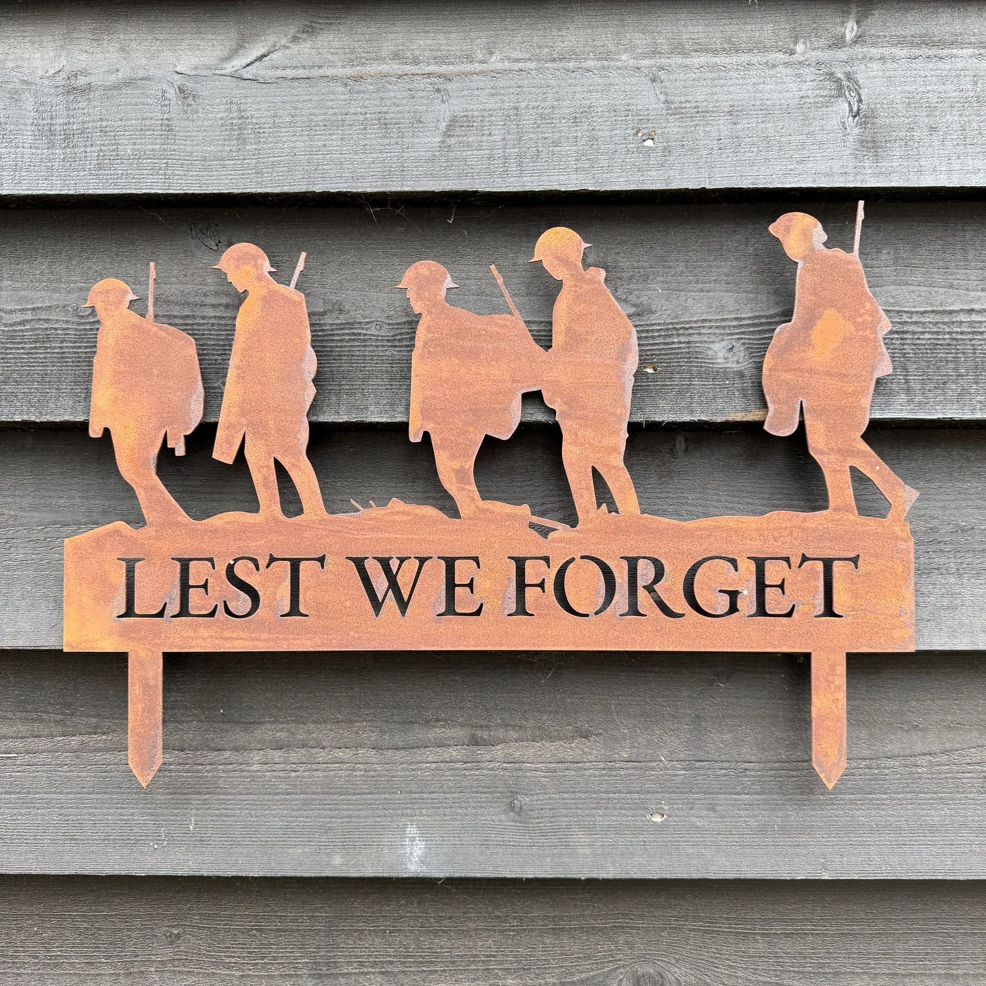A Rusty Metal Lest We Forget Soldier Scene Garden Decoration