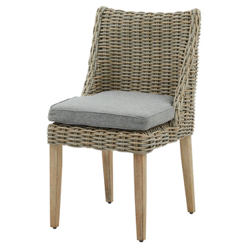 Handwoven beige HDPE wicker outdoor dining chair with powder-coated aluminum frame and quick-dry cushions, Mediterranean style by Hill Interiors at brixbailey.com