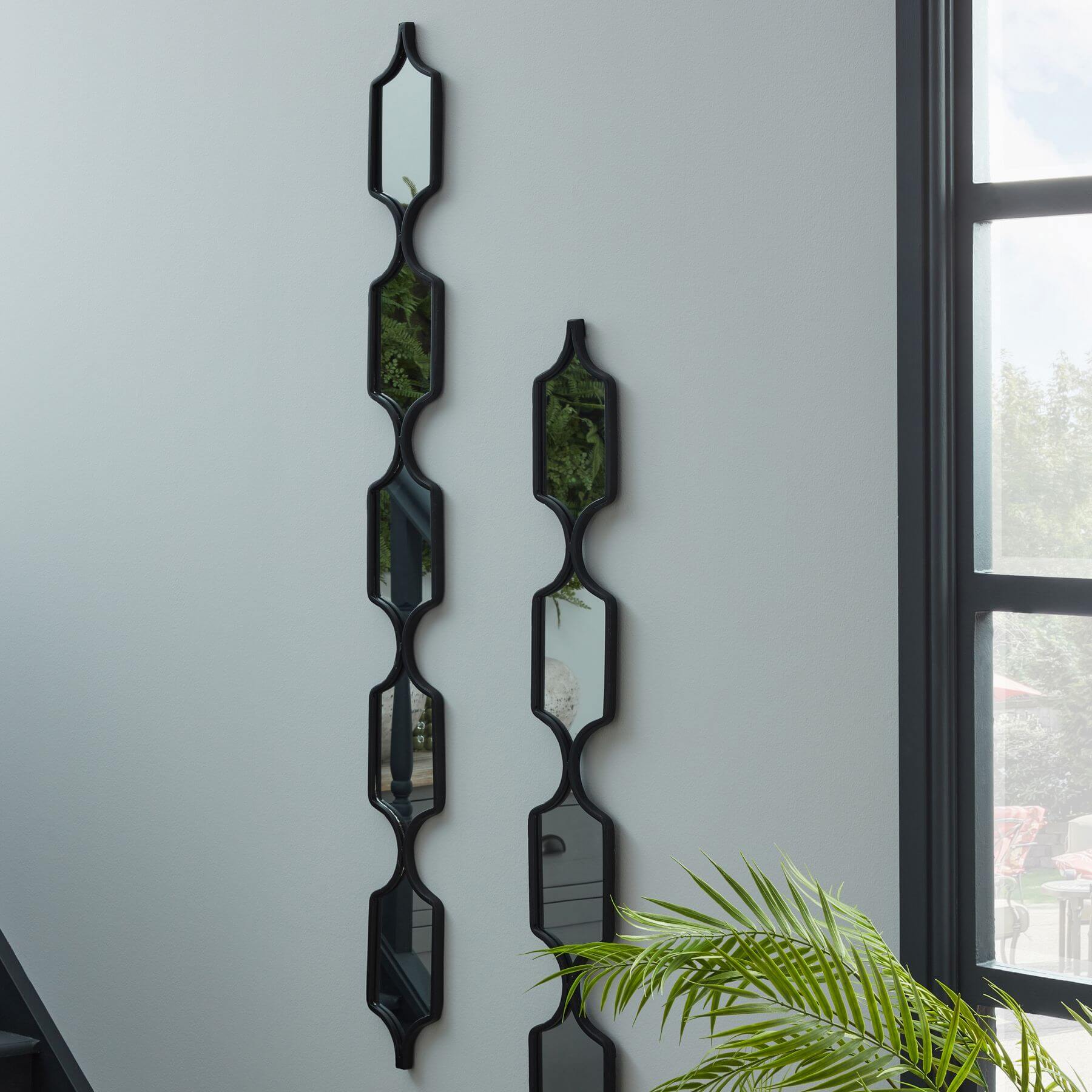 Sleek black hanging mirror with matte metal frame, minimalist rectangular design for modern home decor by RoomLondon at brixbailey.com
