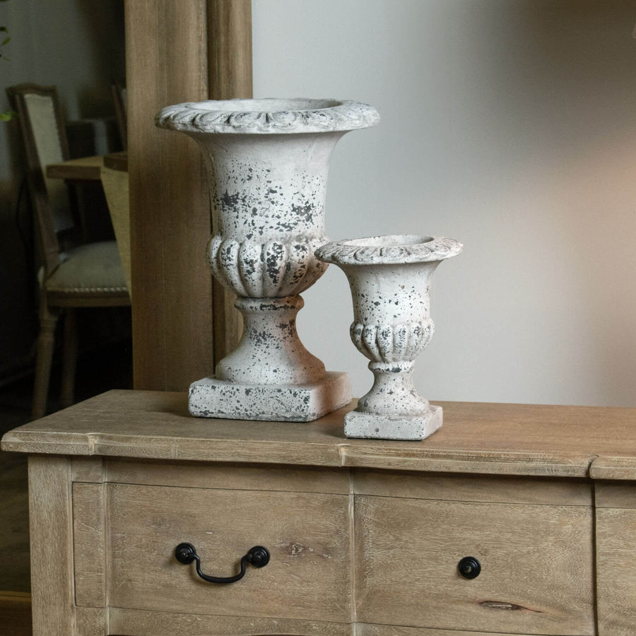 Handcrafted stone-effect ceramic urn with fluted design, neutral color, and classical-modern style for home decor. by Sostter at brixbailey.com