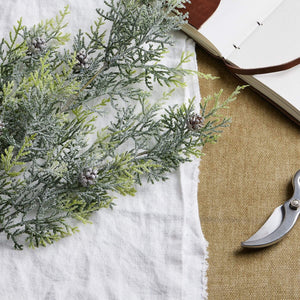 Lifelike frosted pine stem arrangement with crystalline-dusted needles and pinecones for winter decor  by sostter at brixbailey.com