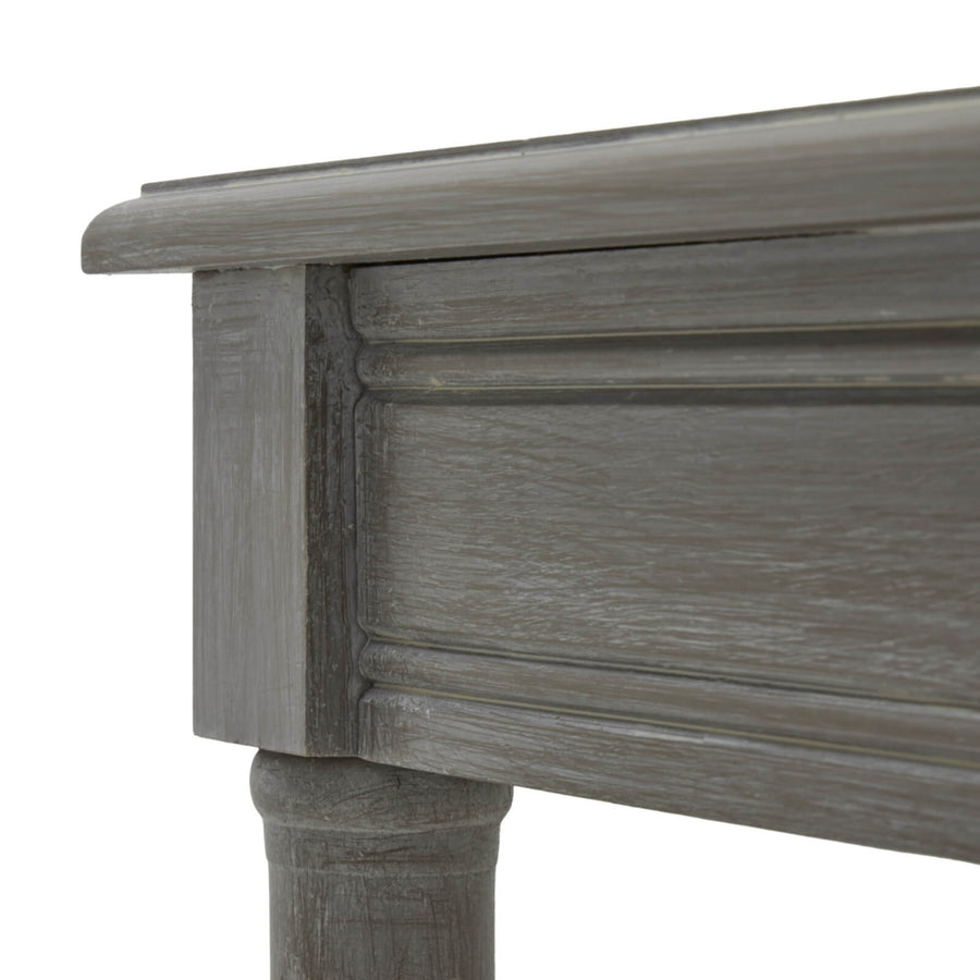 Handwoven rattan side table with soft grey finish, tapered legs, and organic texture for modern interiors. by Sostter at brixbailey.com