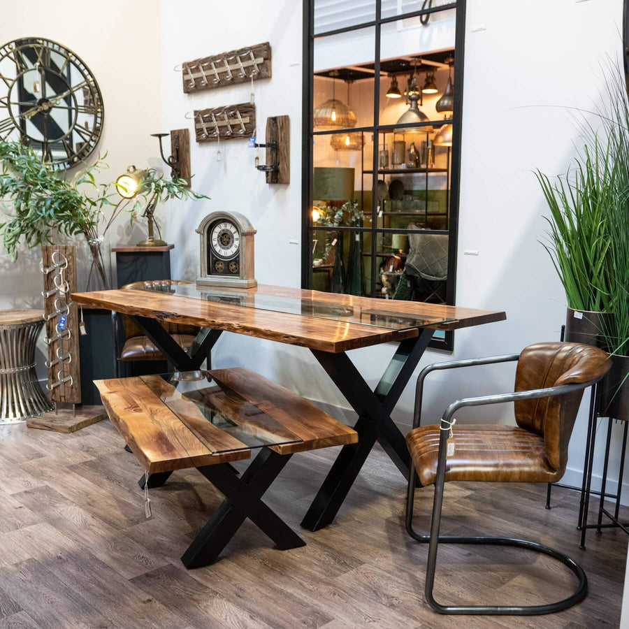 Live edge river dining table with tempered glass center and natural wood edges, warm brown tones. by Sostter at brixbailey.com