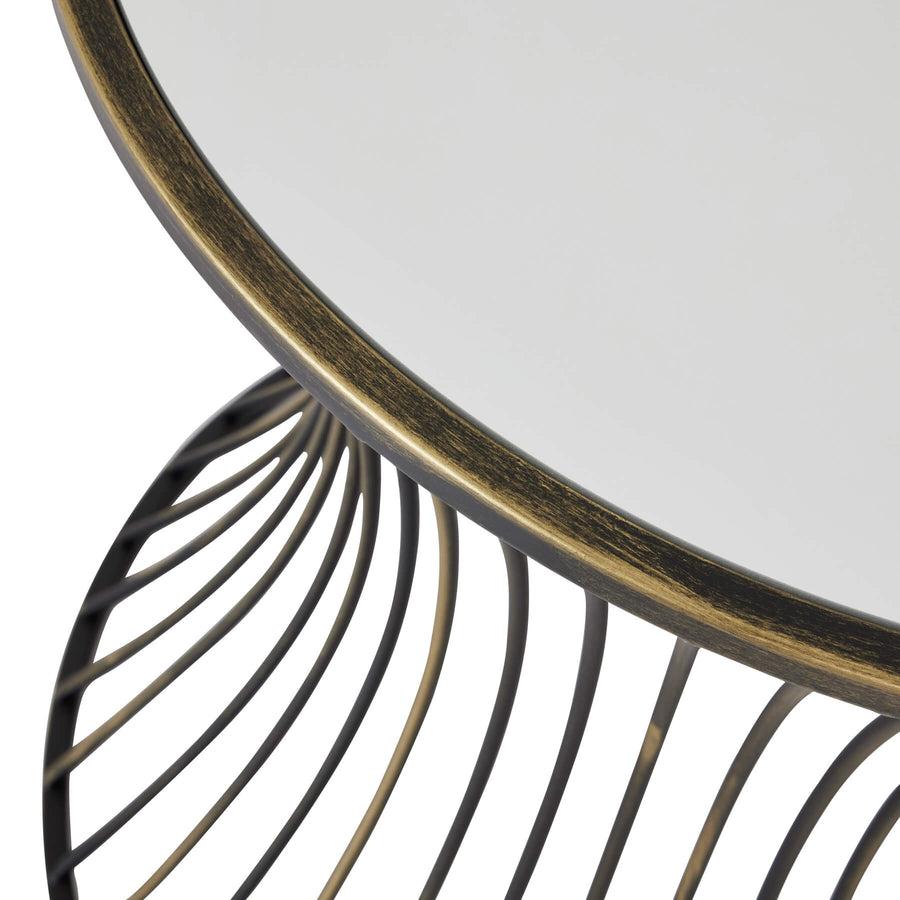 Handcrafted brass side table with black patina finish and mirrored glass surface, modern elegant design for living spaces. by Sostter at brixbailey.com