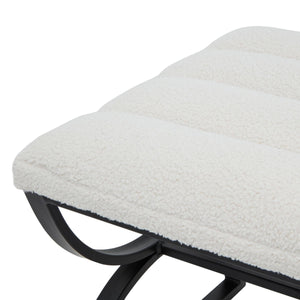 Cream ribbed boucle footstool with black curved metal legs, plush textured upholstery, modern accent piece by sostter at brixbailey.com
