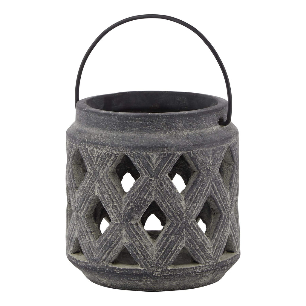 Grey ceramic lattice lantern with geometric Mediterranean patterns, casting intricate shadows when lit. by Sostter at brixbailey.com