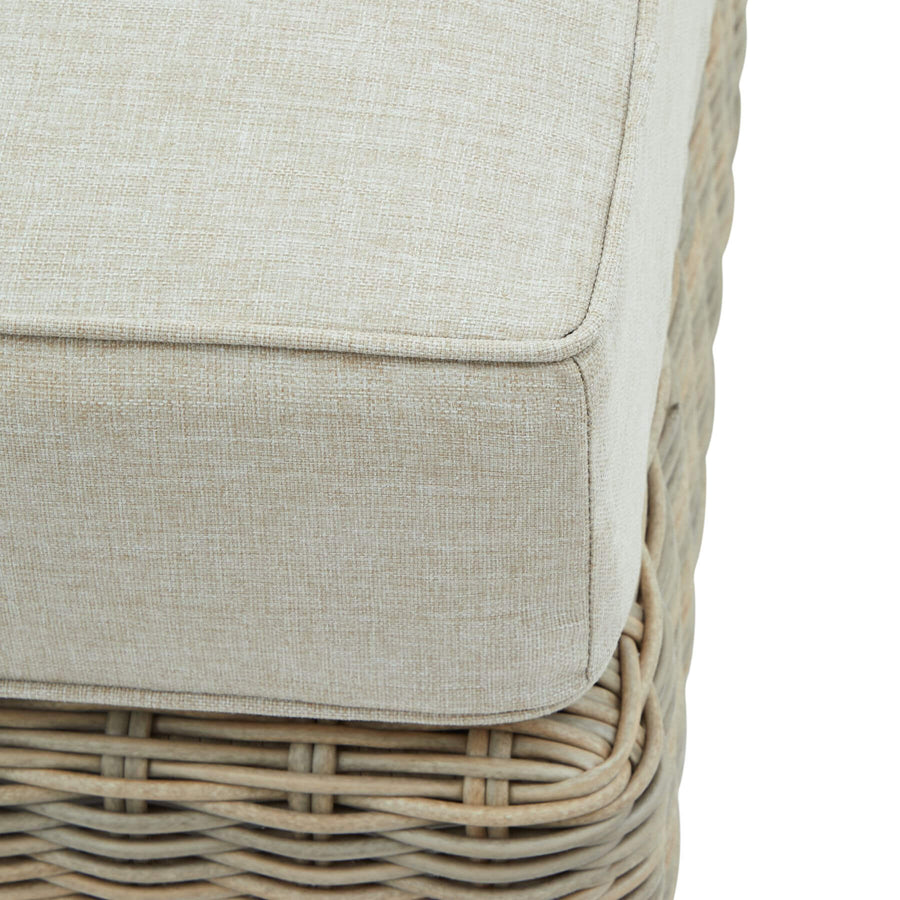 Beige HDPE wicker footstool with Olefin cushion and acacia wood feet for outdoor patio or garden by Sostter at brixbailey.com