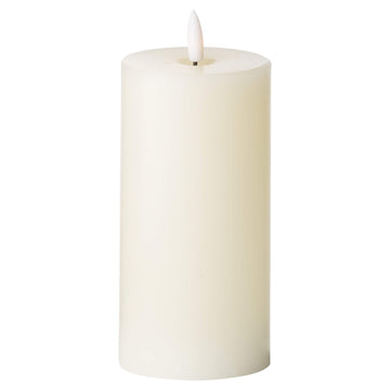 Warm ivory LED flameless candle with realistic flicker, durable plastic, 15cm tall, creates cozy ambiance without flames (124 chars) by Sostter at brixbailey.com