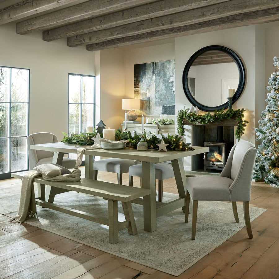 Black wood-framed round mirror, 120cm diameter, solid wood frame, enhances light and space in modern interiors. by Sostter at brixbailey.com