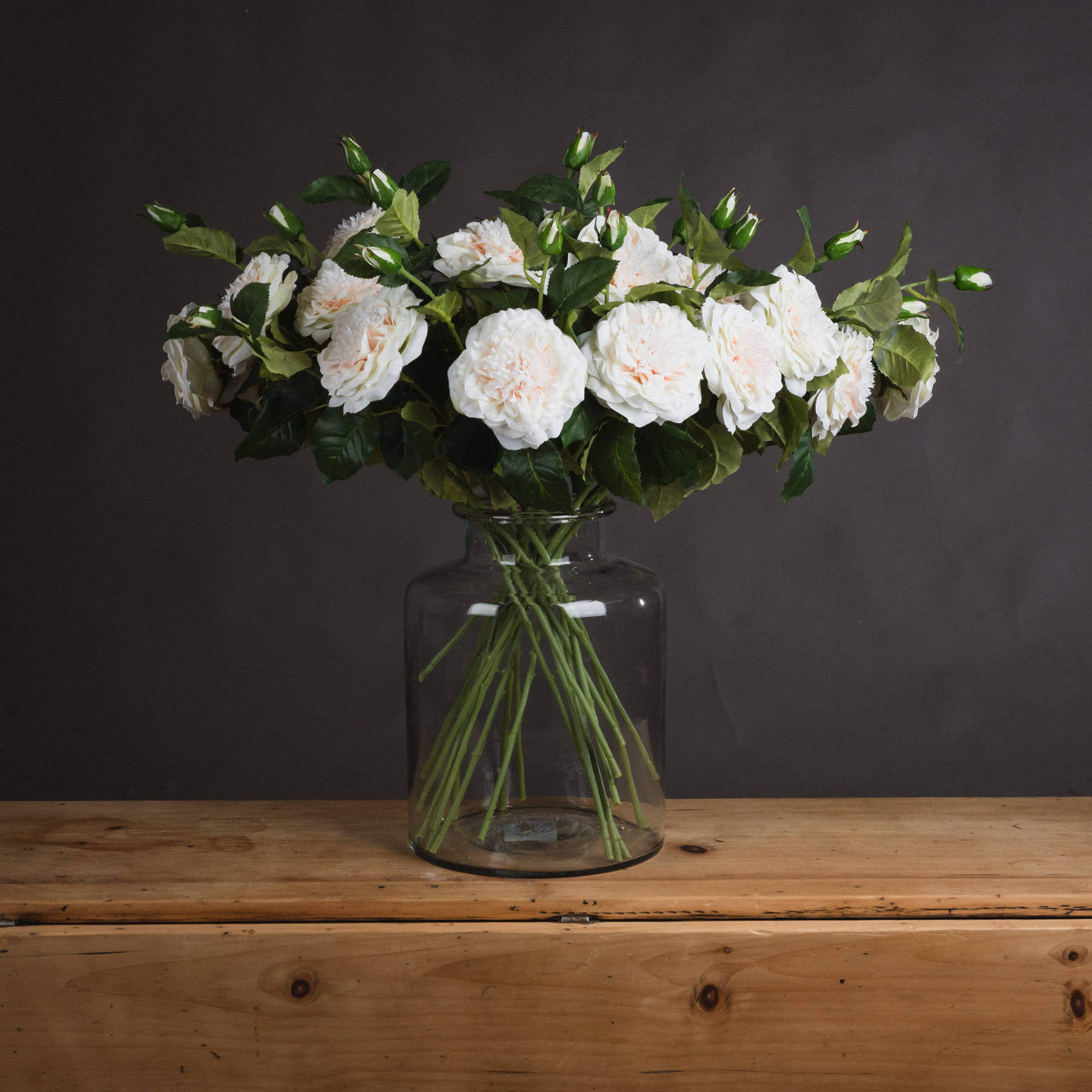 Lifelike white garden rose spray with ivory blooms and textured leaves, 68cm artificial floral arrangement for home decor by RoomLondon at brixbailey.com