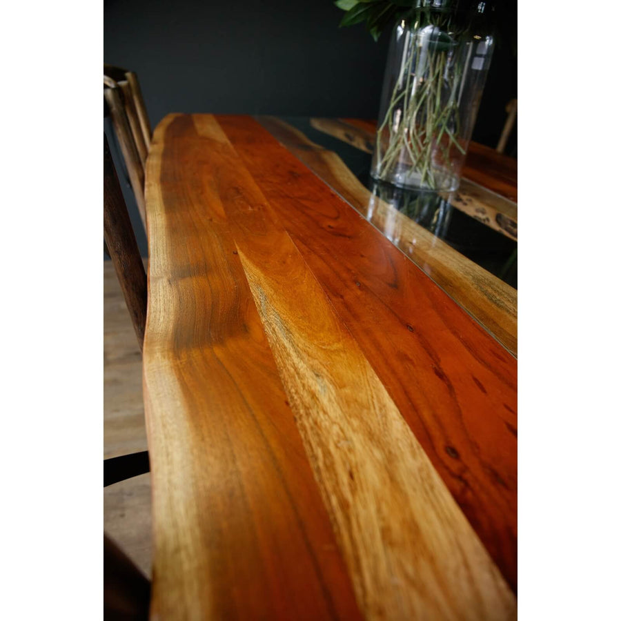 Live edge river dining table with acacia wood, glass center, and black steel legs, modern rustic design. by Sostter at brixbailey.com