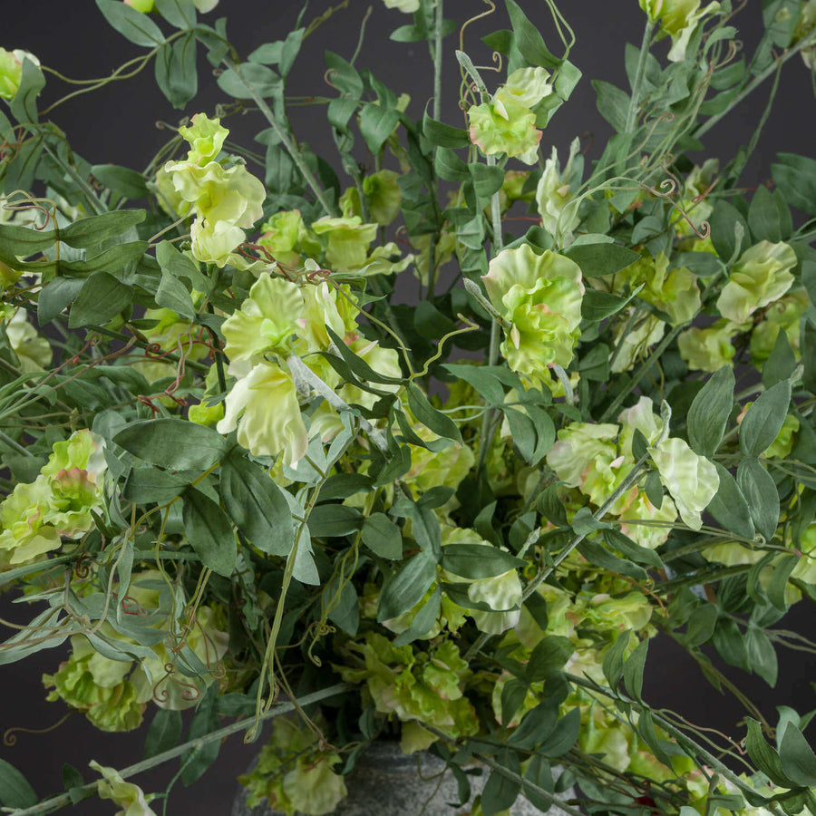 Lifelike artificial sweet pea trail with soft pastel blooms, perfect for wedding decor or elegant home arrangements by Sostter at brixbailey.com
