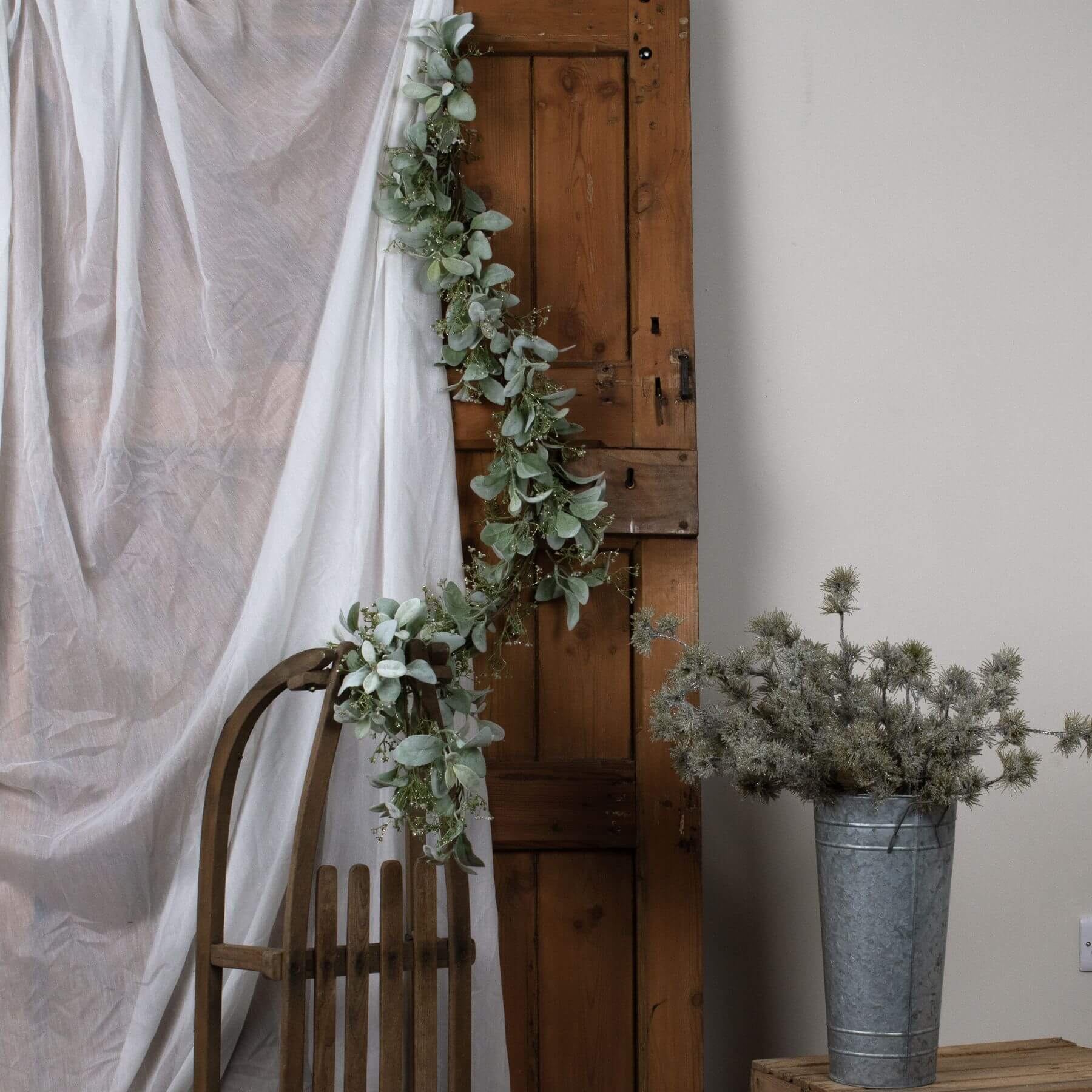 Elegant winter garland with lamb's ear foliage and wax flowers in soft grey and green tones, 153cm long by Sostter at brixbailey.com