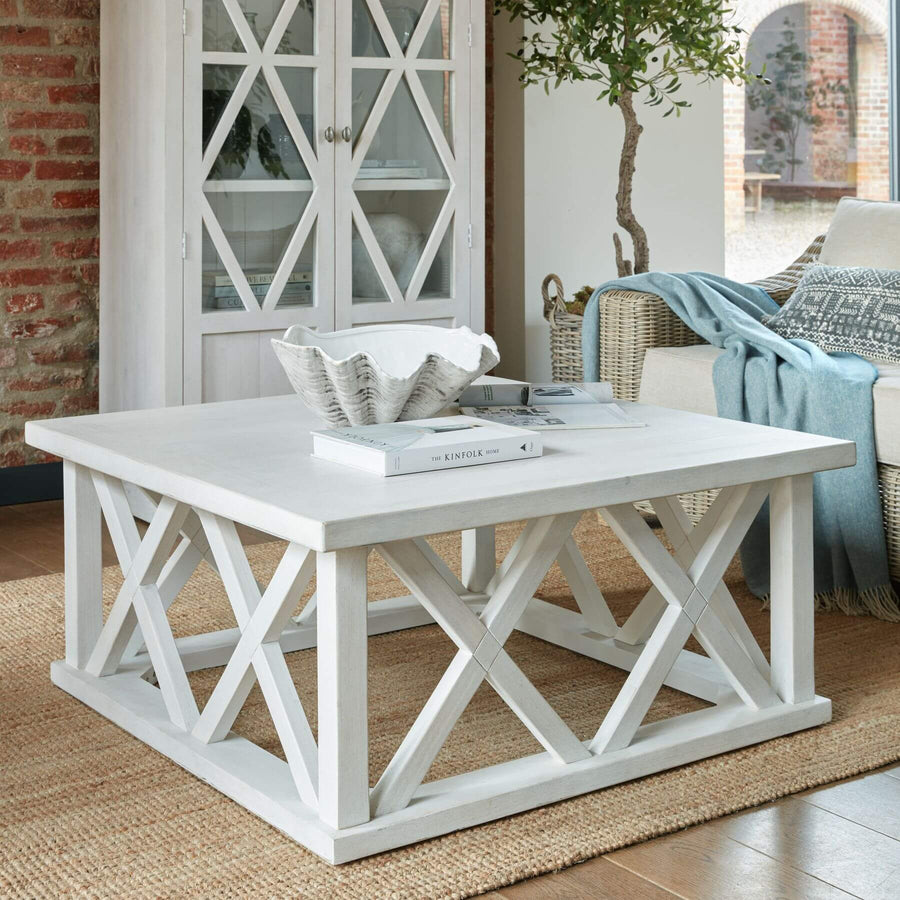 Handcrafted square pine coffee table with lattice design, distressed white finish, and modern farmhouse style. by Sostter at brixbailey.com