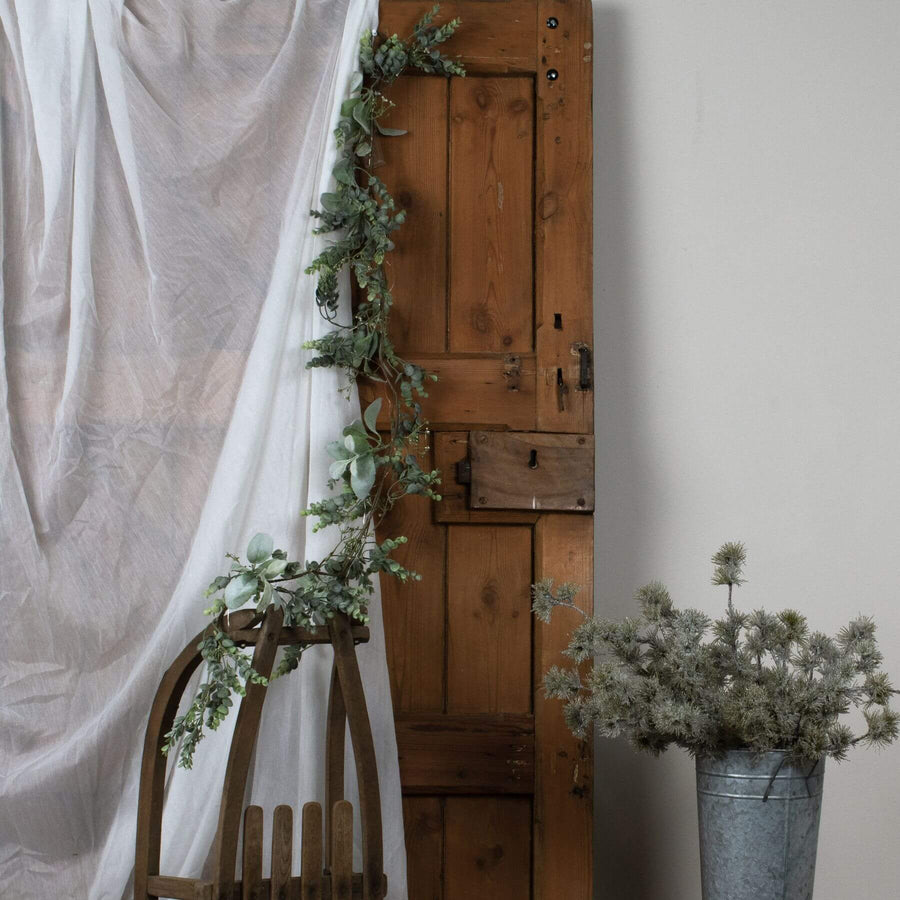 Frosted eucalyptus LED garland with silver accents, 5 feet long, battery-operated winter decor for mantels or tables by Sostter at brixbailey.com