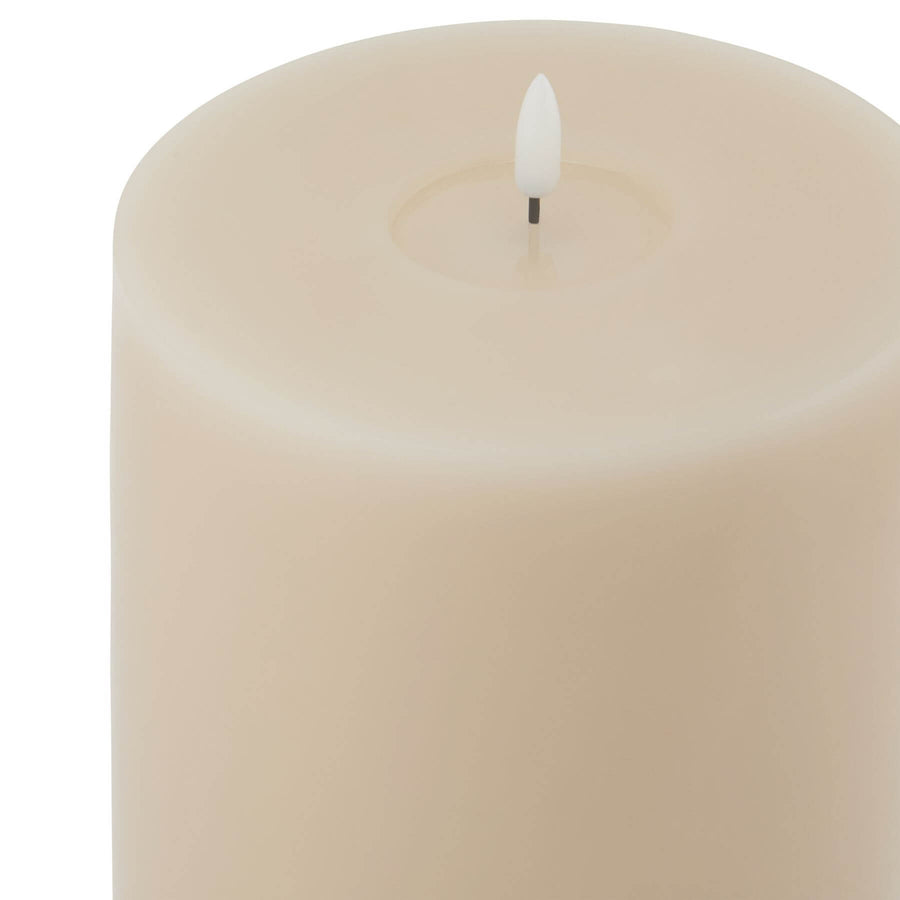 Realistic taupe LED candle with dripping wax effect, flameless and smokeless, 6x12 inches for home decor ambiance by Sostter at brixbailey.com