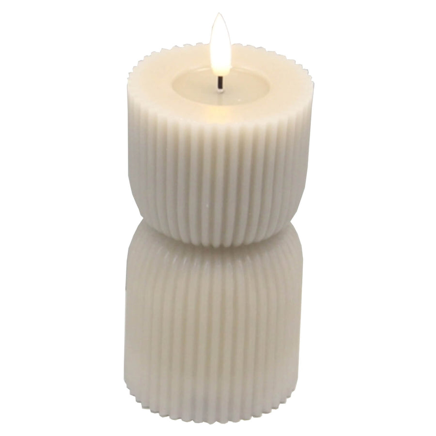 Hand-carved LED candle with natural stone texture, realistic flickering flame, 15cm height, warm ambient light for home decor by Hill Interiors at brixbailey.com