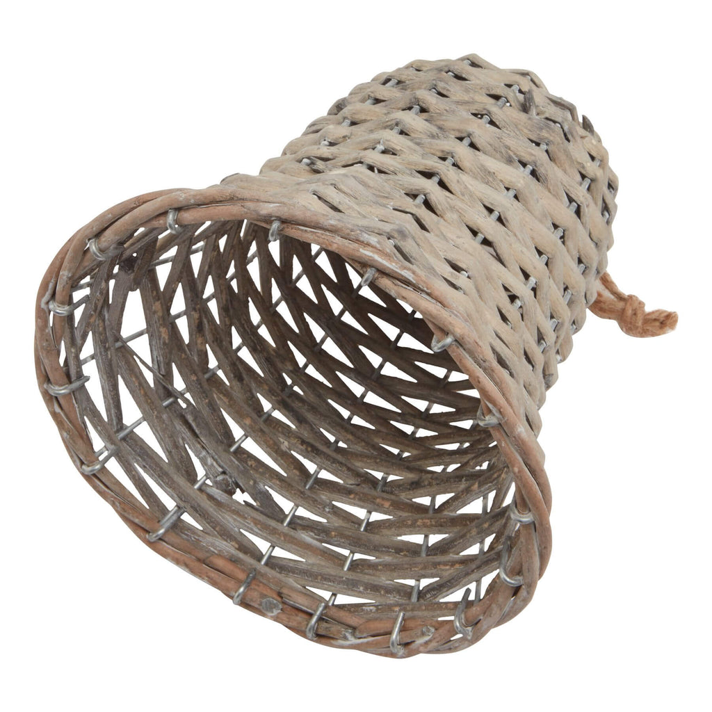 Handwoven wicker holiday bell in rich brown, 15cm tall, casting delicate shadow patterns for festive decor. by RoomLondon at brixbailey.com