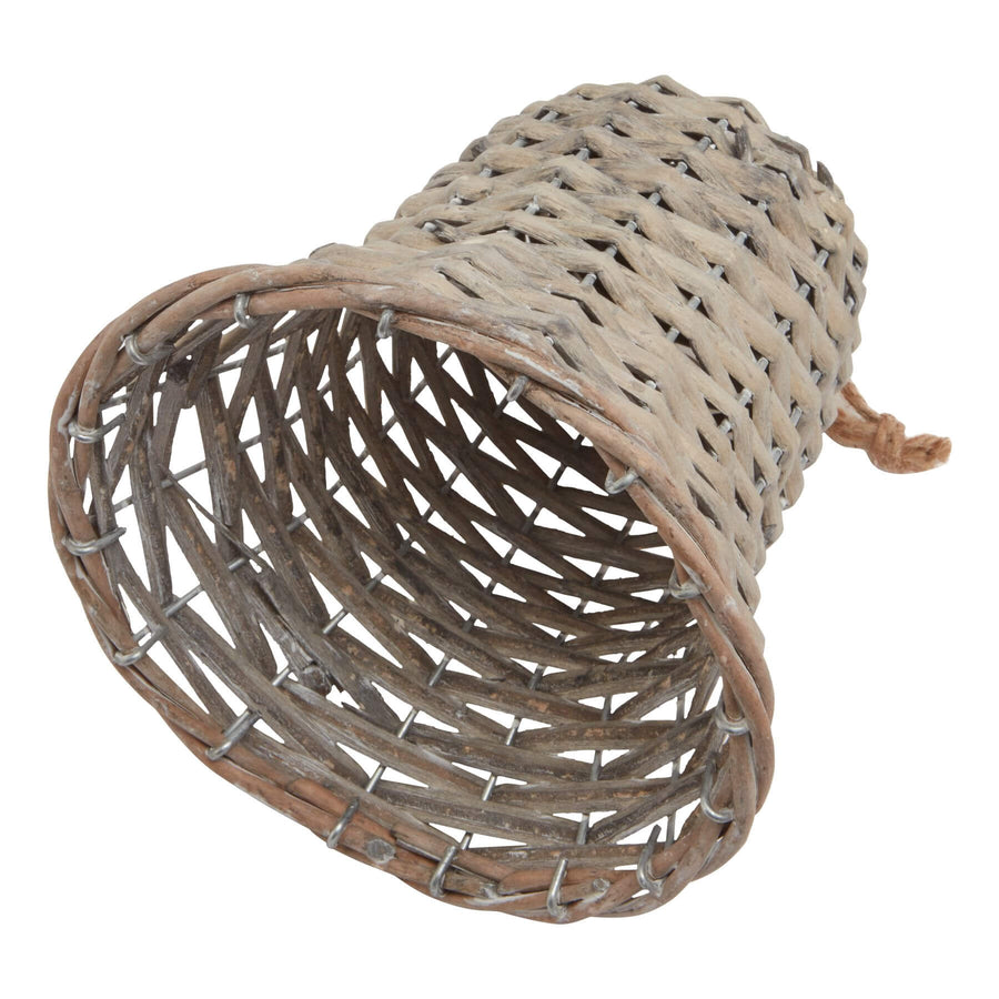 Handwoven wicker holiday bell in rich brown, 15cm tall, casting delicate shadow patterns for festive decor. by Hill Interiors at brixbailey.com