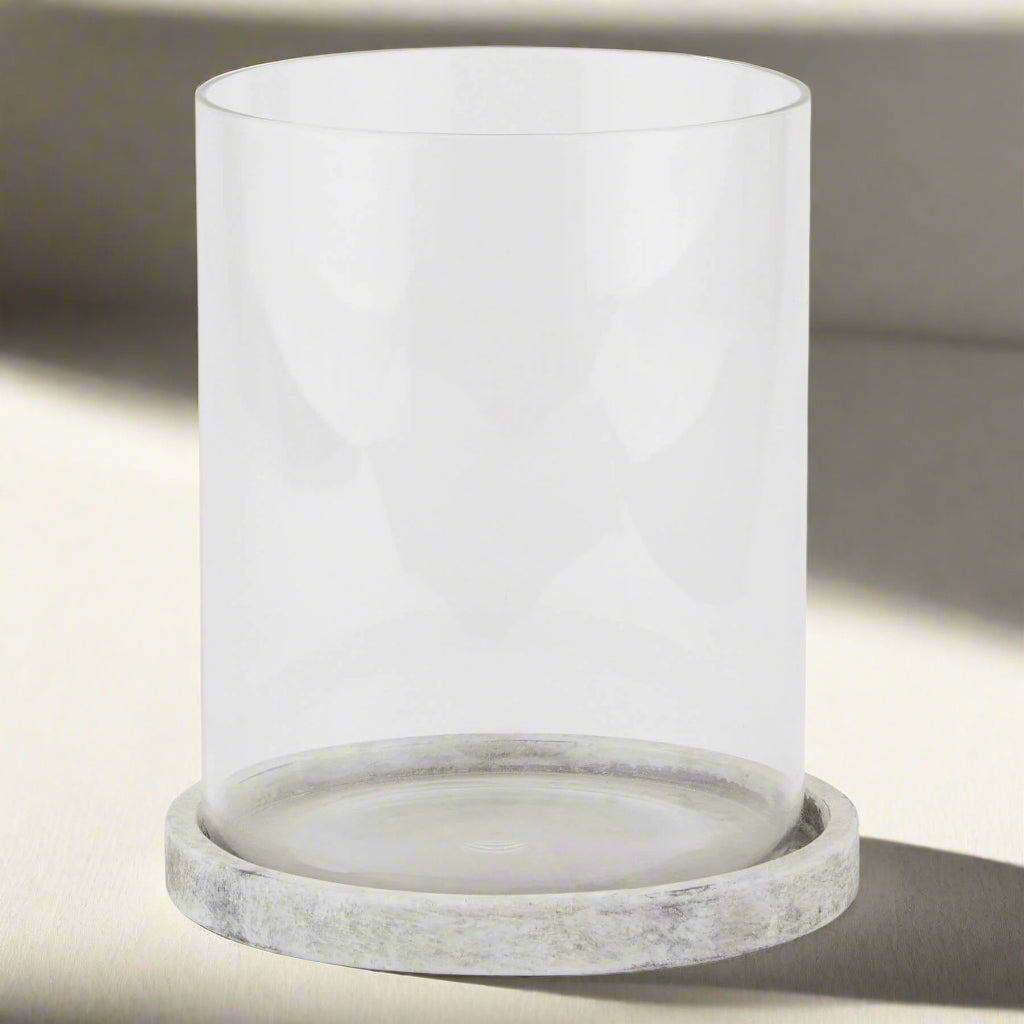 Handcrafted white ceramic hurricane lantern with stone-effect finish, glass enclosure, and Mediterranean-inspired design. by Sostter at brixbailey.com