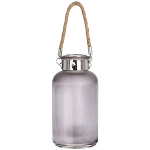 Frosted grey glass lantern with star-like LED glow, natural rope handle, modern rustic design for indoor or outdoor ambiance. by sostter at brixbailey.com