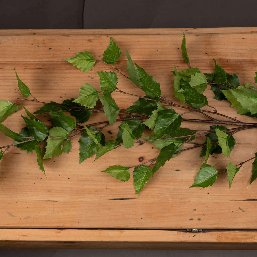 Lifelike green branch spray with lush foliage, 128 cm tall, perfect for seasonal home decor arrangements by Sostter at brixbailey.com