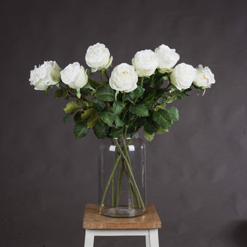 Lifelike white artificial rose stem with realistic petals, perfect for home decor or floral arrangements  by Sostter at brixbailey.com