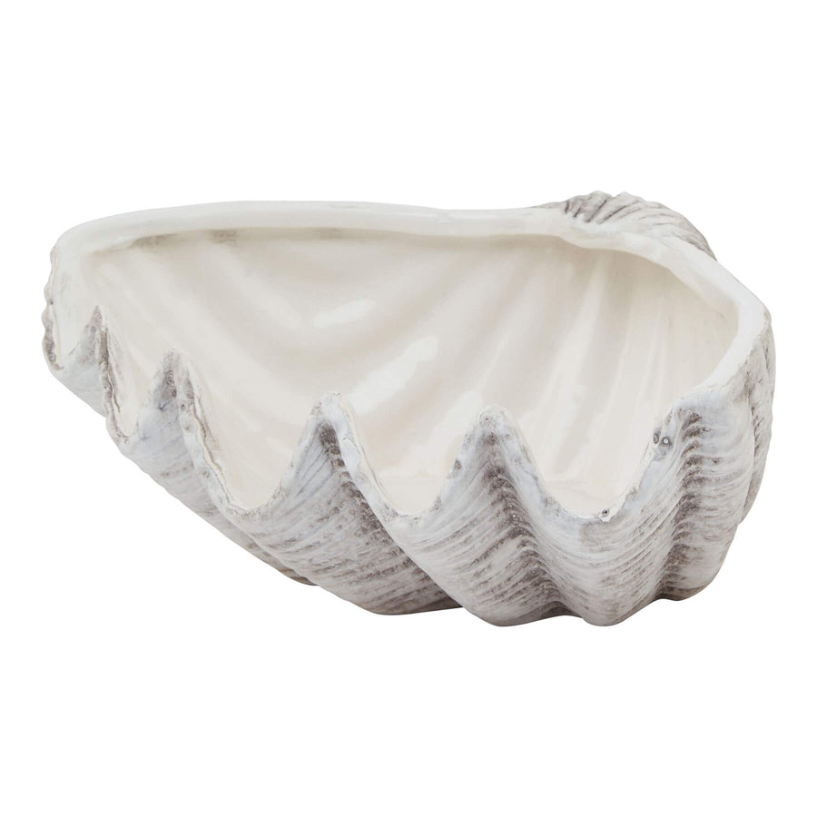 Handcrafted white ceramic shell bowl with organic spiral design and matte finish, perfect for coastal-inspired decor. by Sostter at brixbailey.com