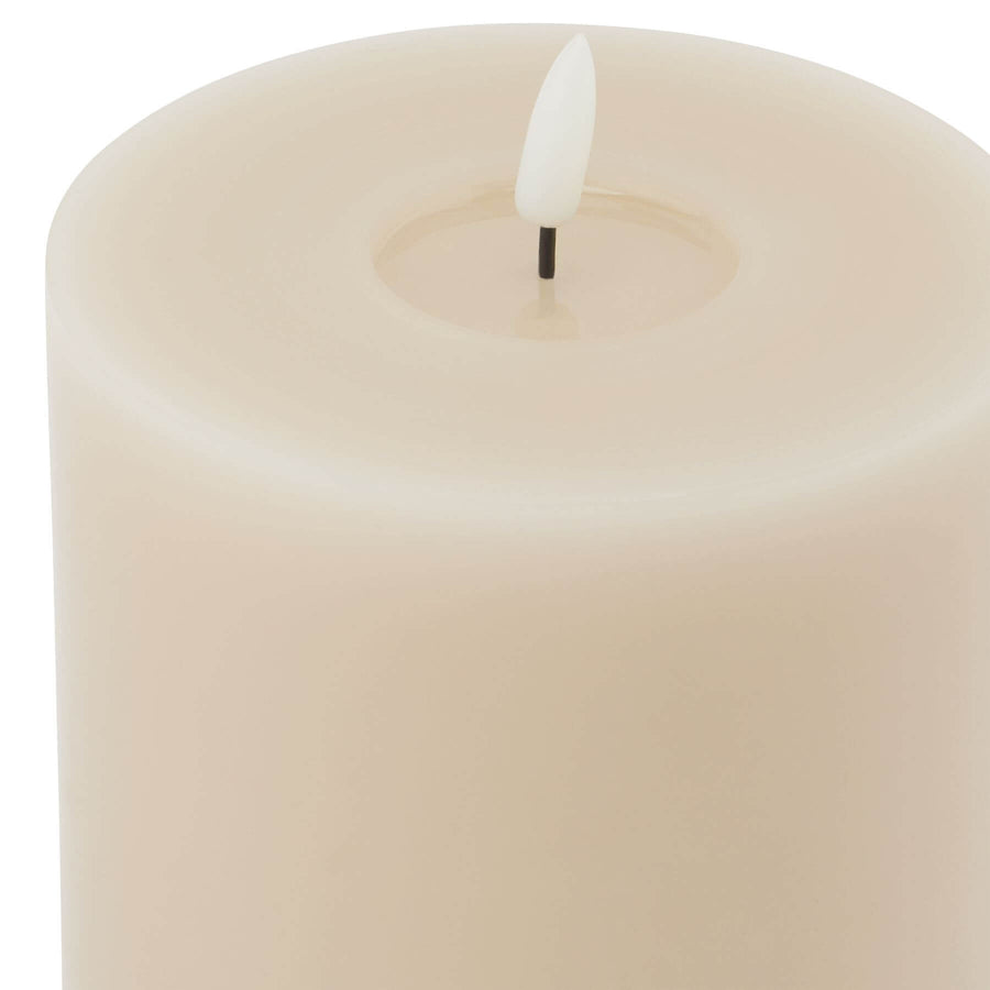 Taupe LED wax candle with realistic melt effect and flickering glow for home decor ambiance by Sostter at brixbailey.com