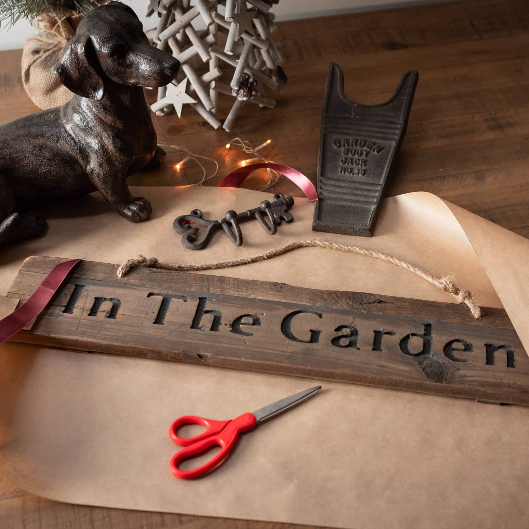 Handcrafted cast iron boot jack with rustic brown patina for effortless boot removal by RoomLondon at brixbailey.com