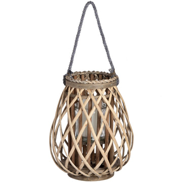 Handwoven rattan lantern with bulbous shape, natural brown wicker, casting warm light patterns for home decor. by Sostter at brixbailey.com