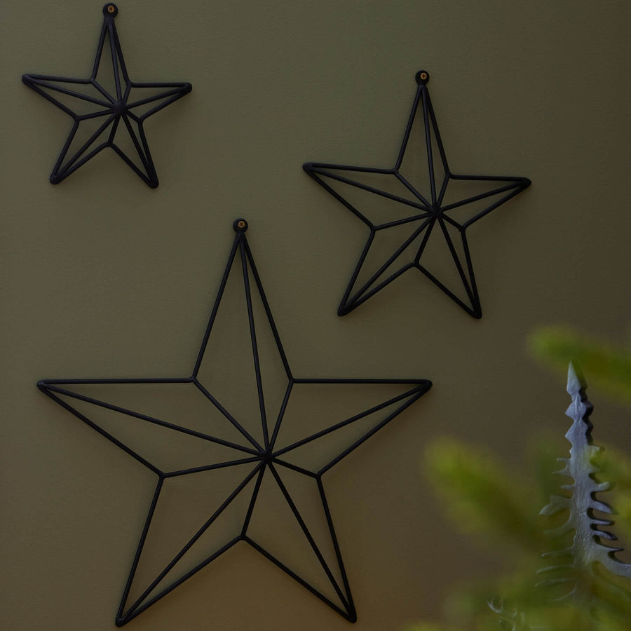 Matte black convex metal star wall art, modern dimensional decor for contemporary or industrial spaces by Sostter at brixbailey.com