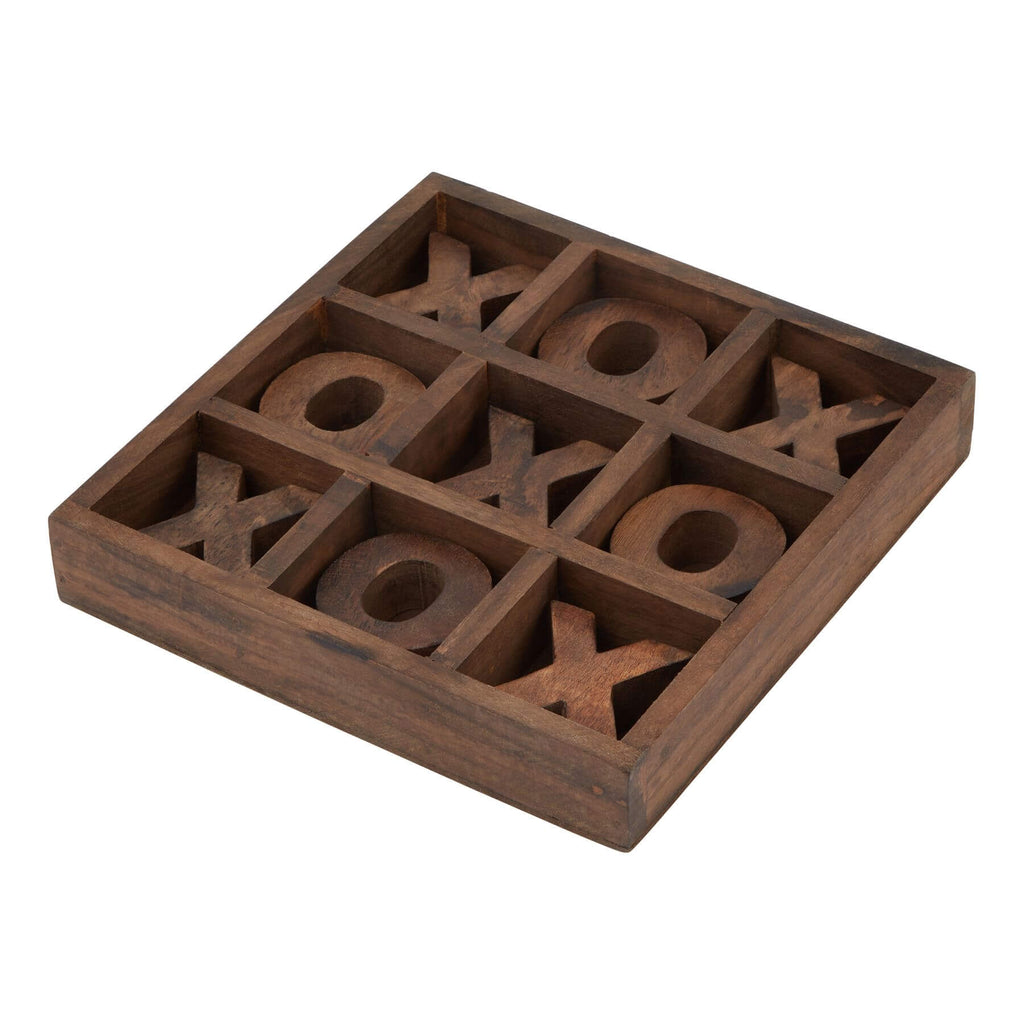 a bold close-up of the solid wood noughts and crosses game set on a modern table