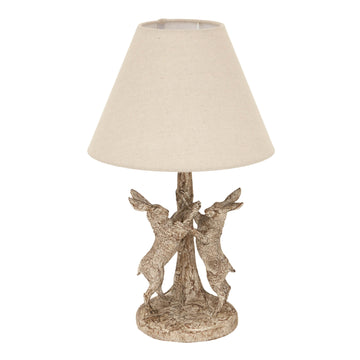 Stonewashed grey-brown Marching Hares table lamp with sculpted resin hares and natural linen shade by Sostter at brixbailey.com