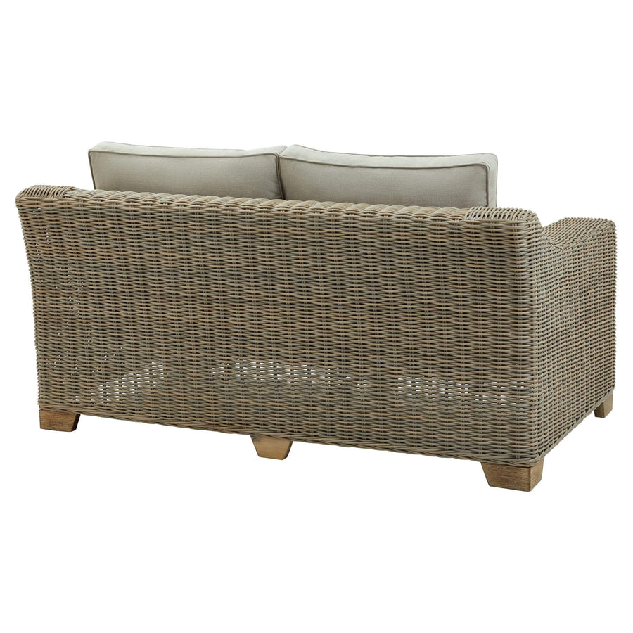 Beige two-seater outdoor sofa with HDPE wicker weave, aluminum frame, and acacia wood feet, paired with Olefin cushions. by Sostter at brixbailey.com