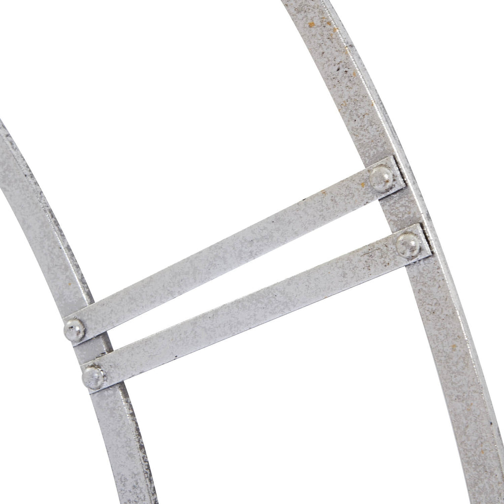 Modern circular silver metal wall shelf with industrial-chic design for displaying books, plants, or decor by Sostter at brixbailey.com