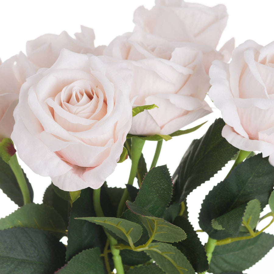 Lifelike pastel pink faux tea rose with realistic green foliage, perfect for home decor or bouquets. by Sostter at brixbailey.com