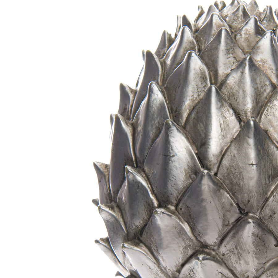 Silver pinecone finial decor with ceramic base and lustrous metallic finish for shelves or tables by Sostter at brixbailey.com