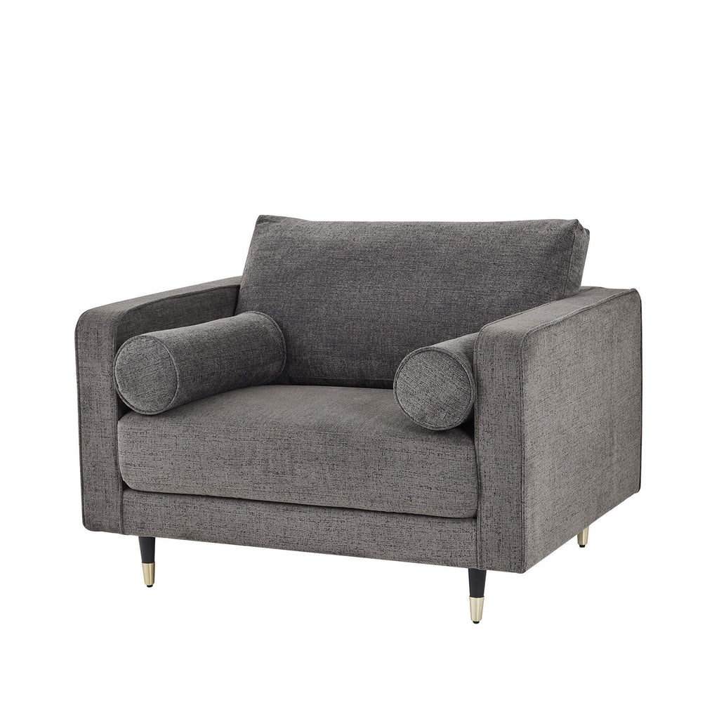 Grey fabric armchair with plush cushioning, curved arms, and neutral tone for modern or traditional interiors by Sostter at brixbailey.com