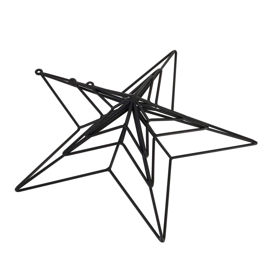 Matte black convex metal star wall art, modern 3D decor for contemporary or industrial interiors, 35cm wide. by Sostter at brixbailey.com