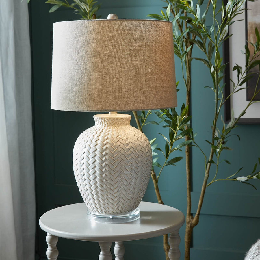 Handcrafted white ceramic table lamp with twill weave texture and linen shade for warm ambient lighting by Sostter at brixbailey.com
