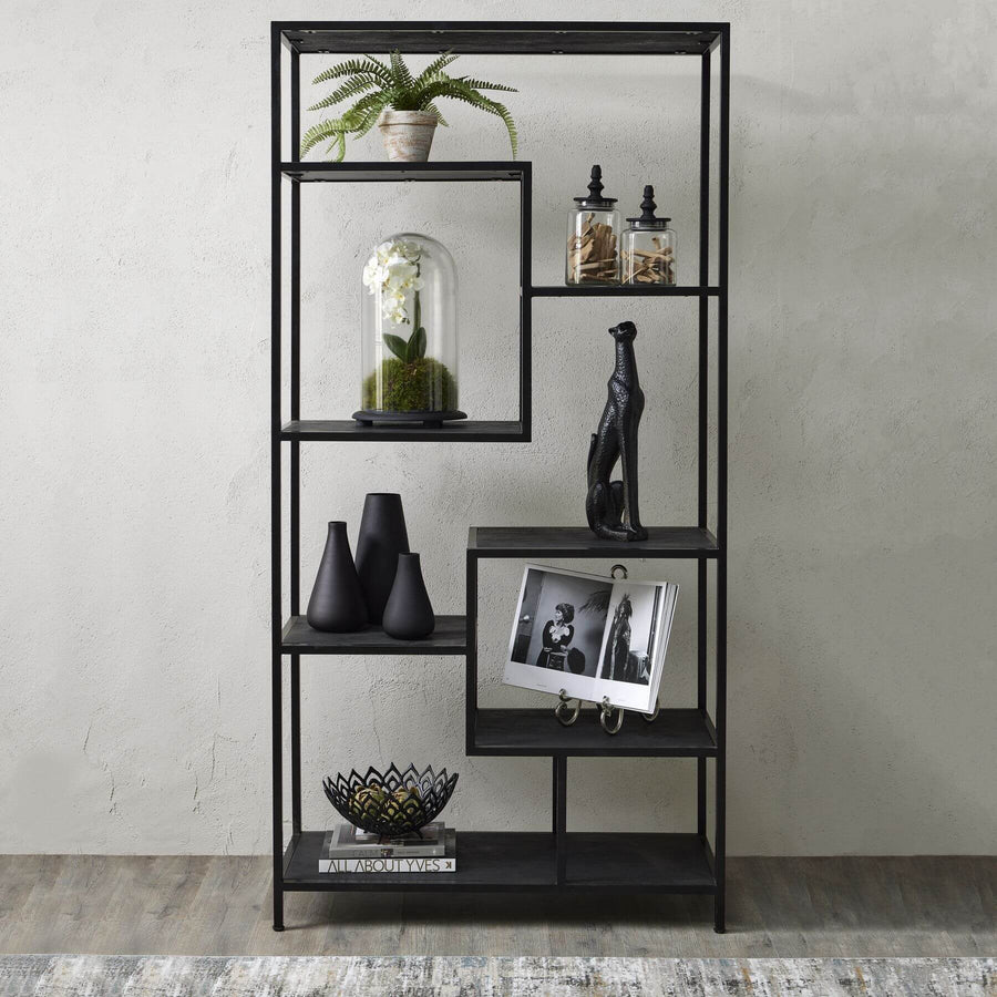 Black metal industrial shelf unit with asymmetrical seven-shelf design and lattice framework for modern home decor by Sostter at brixbailey.com