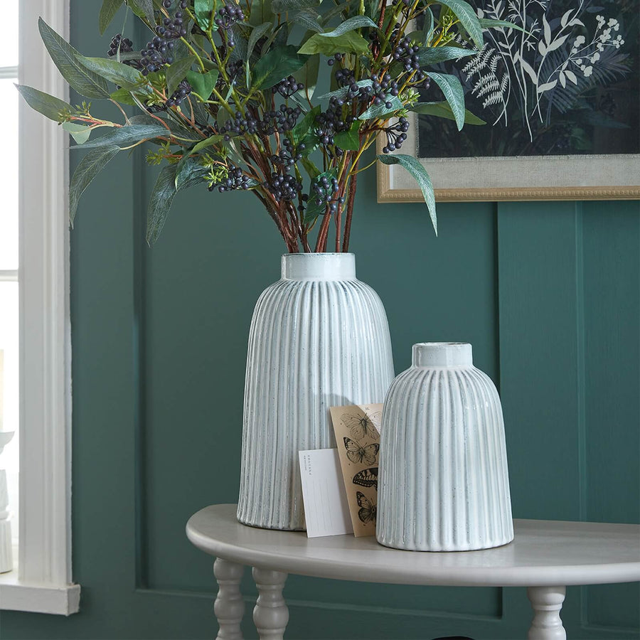 Hand-blown Monte vase in pure white ceramic, minimalist bell shape with crystal-clear glaze for modern decor. by Sostter at brixbailey.com