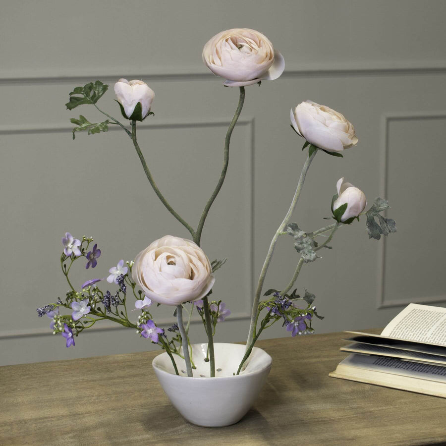 Handcrafted ceramic flower frog in classic off-white, with precision holes for floral arrangements, glazed finish. by Sostter at brixbailey.com