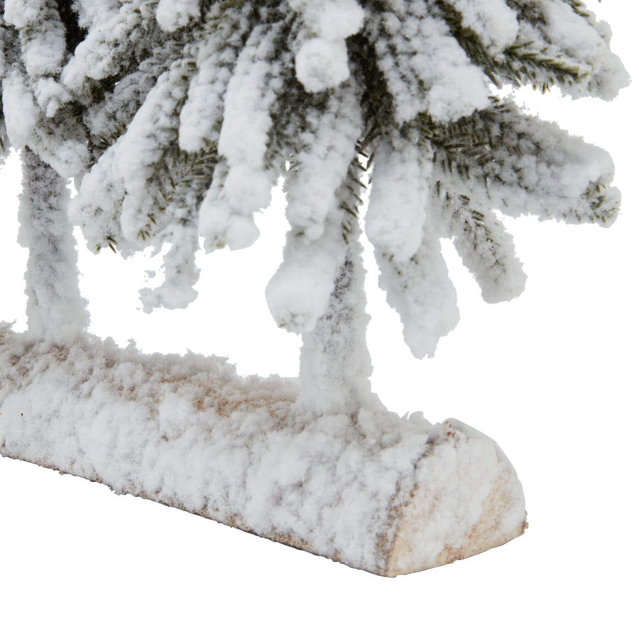 Snow-dusted fir tree duo on rustic wooden base, perfect for winter decor and holiday centerpieces. by Sostter at brixbailey.com