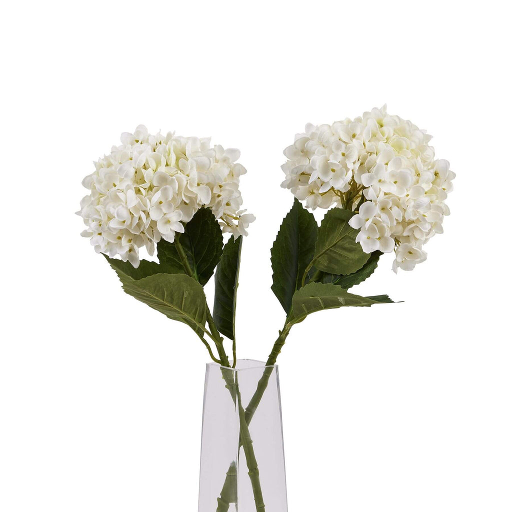 White artificial hydrangea stem with realistic petals, pristine white florets, and green sturdy stem for floral arrangements. by Sostter at brixbailey.com
